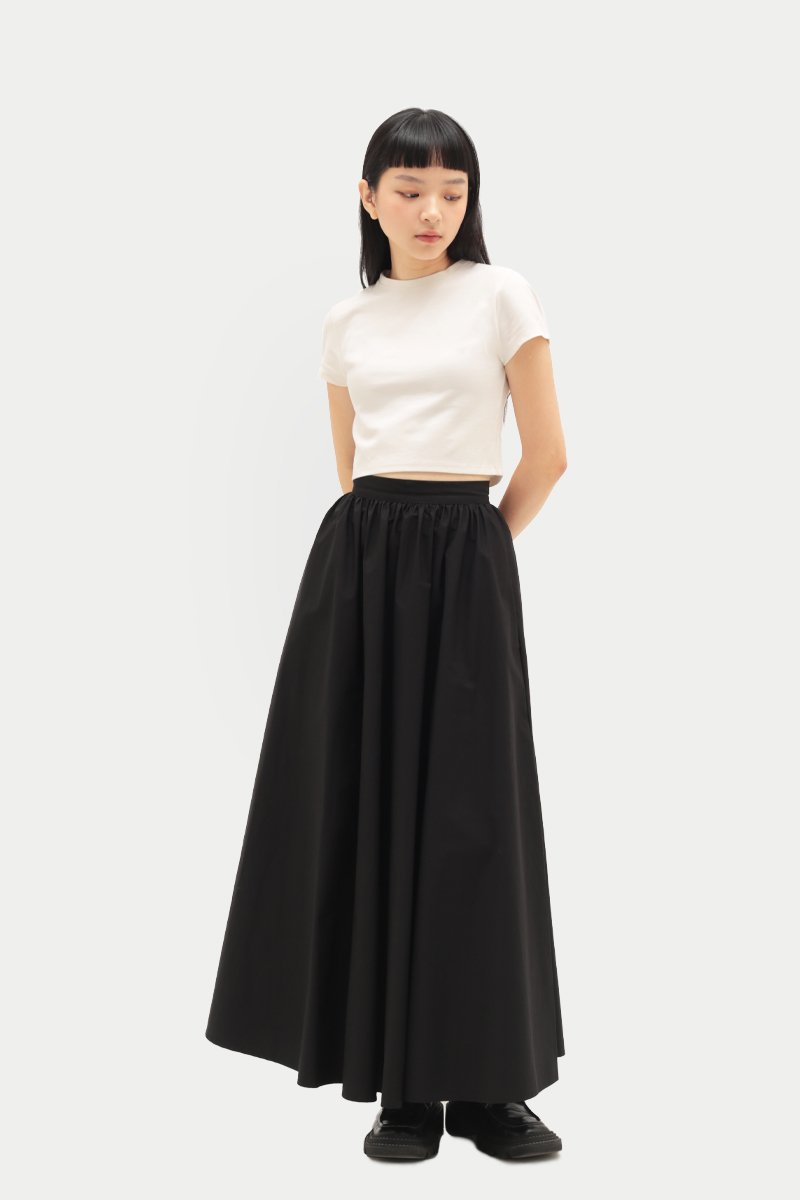 https://d3lc44byil53r.cloudfront.net/sites/files/aforarcade/images/products/202304/800x1200/poffy_maxi_skirt_in_black_2.jpg
