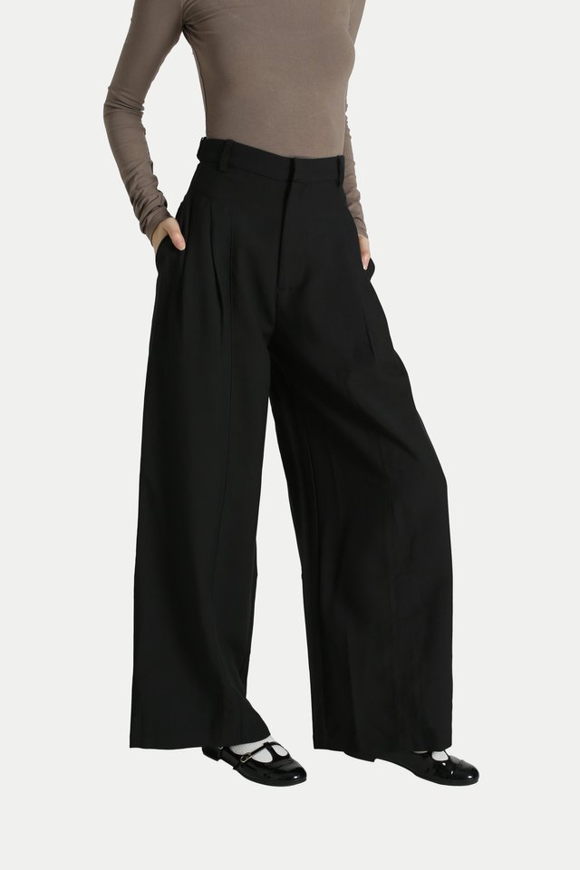 AMARI SIDE PLEAT FLARE TROUSERS IN BLACK