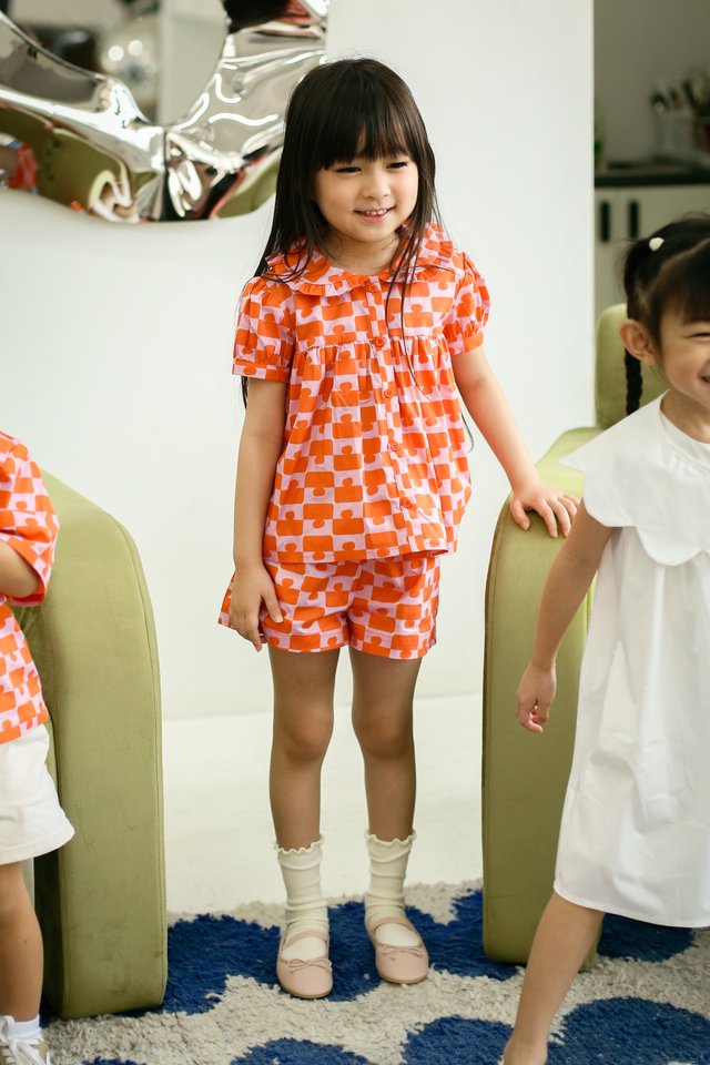 EVIE “JIGGY” MINI SHORTS IN ORANGE/PINK