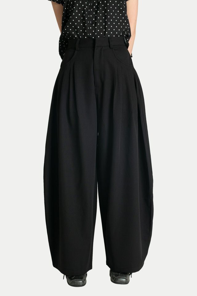 REIKO PLEATED CURVED TROUSERS IN BLACK