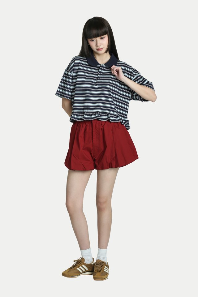 JOY STRIPE PEPLUM POLO TOP IN BLUEBERRY