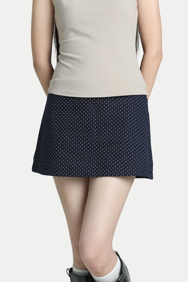 NELLA MID-RISE MINI SKORTS IN NAVY DOTS