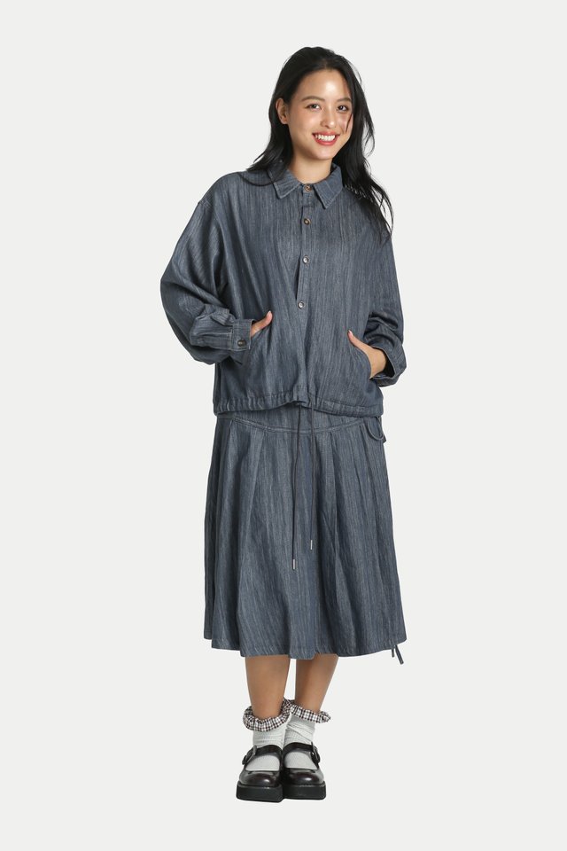 ATSUKO PLEATED MIDI SKIRT IN VINTAGE DENIM