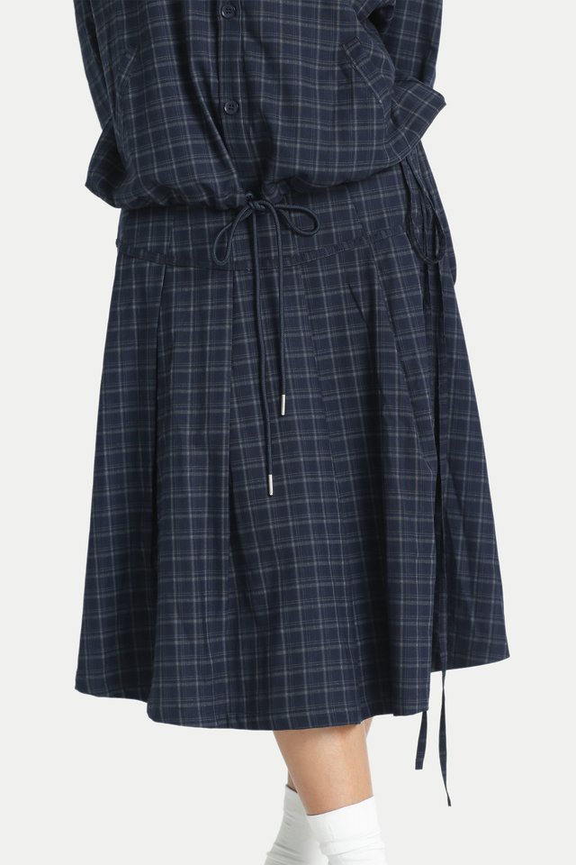 ATSUKO PLEATED MIDI SKIRT IN NAVY CHECKS