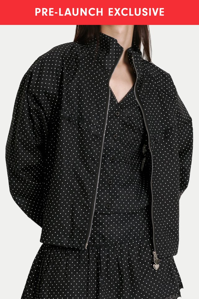 MYLO LIGHT ZIP-UP FRILL JACKET IN BLACK DOTS